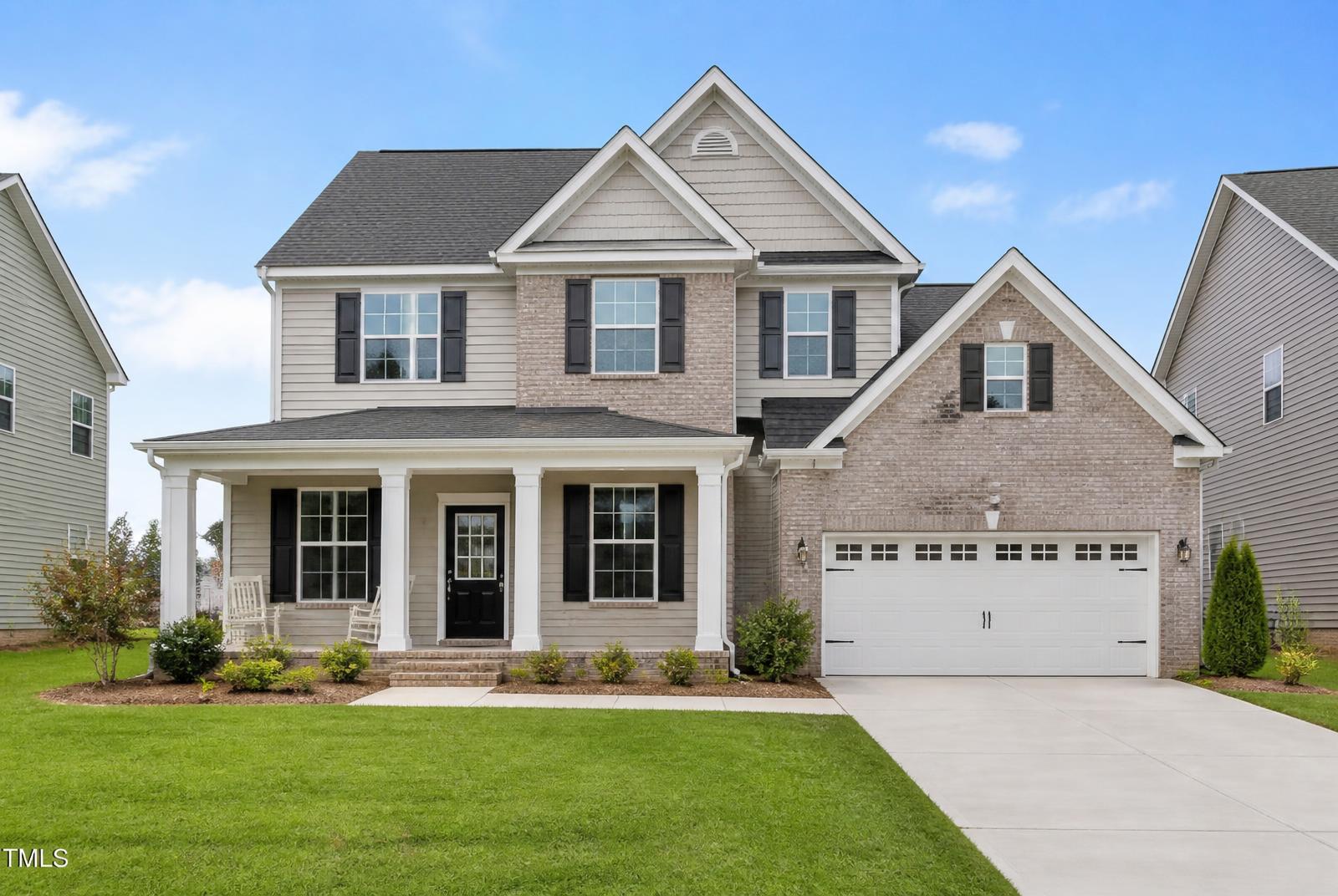 Newly built two-story home with brick and siding exterior — concept image for residential construction in Rockford, TN